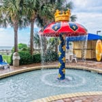 outdoor mushroom fountain and kiddie pool at camelot by the sea